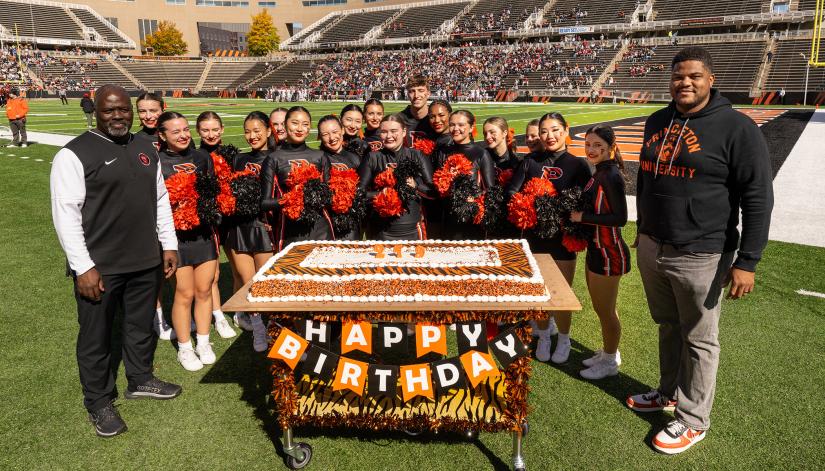 on field cake celebration at homecoming 2025