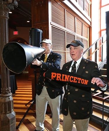 Kirk Unruh '70 and Rand Mirante '70 with megaphone and pennant