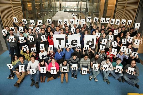 Chemistry grad students holding up Thank You signs