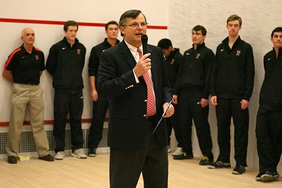 Bob Callahan speaks on a microphone prior to a match 