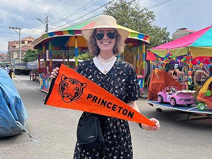 Mary Grace Walker, a Bridge Year student in Bolivia, brought a piece of Princeton with her while attending the Festival de San Miguel for the patron saint of Tiquipaya. 