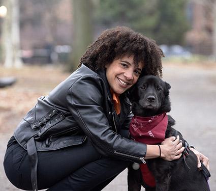 Adrienne Umeh posing with her dog in Central Park, New York City