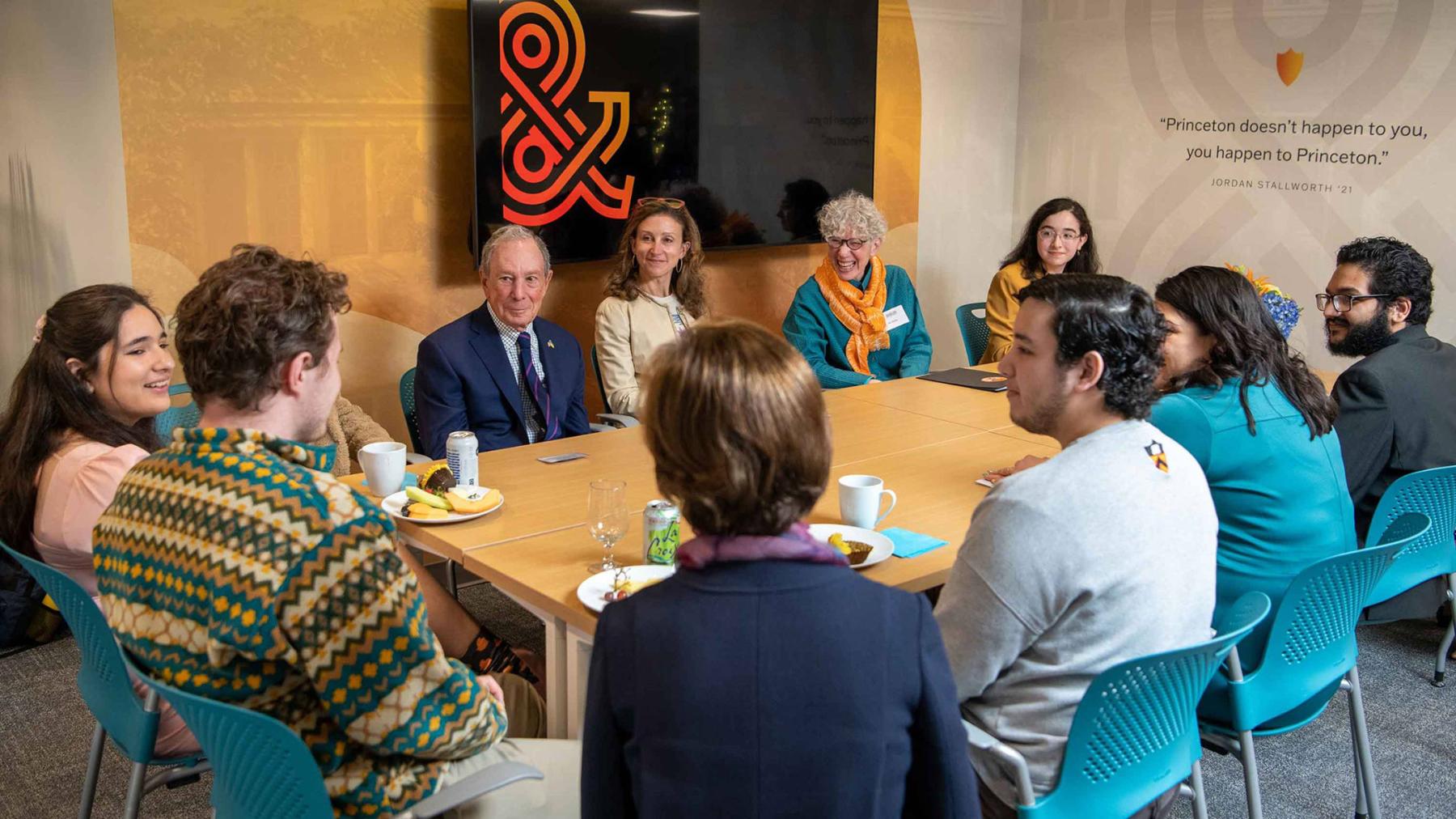 Michael R. Bloomberg and Emma Bloomberg (center) enjoy an informal roundtable conversation with a small group of students inside the center before the ceremony. Photo by Craig Warga