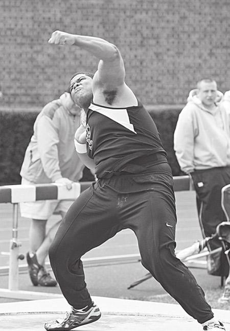 Eric Plummer throws a shot put for Princeton in 2010