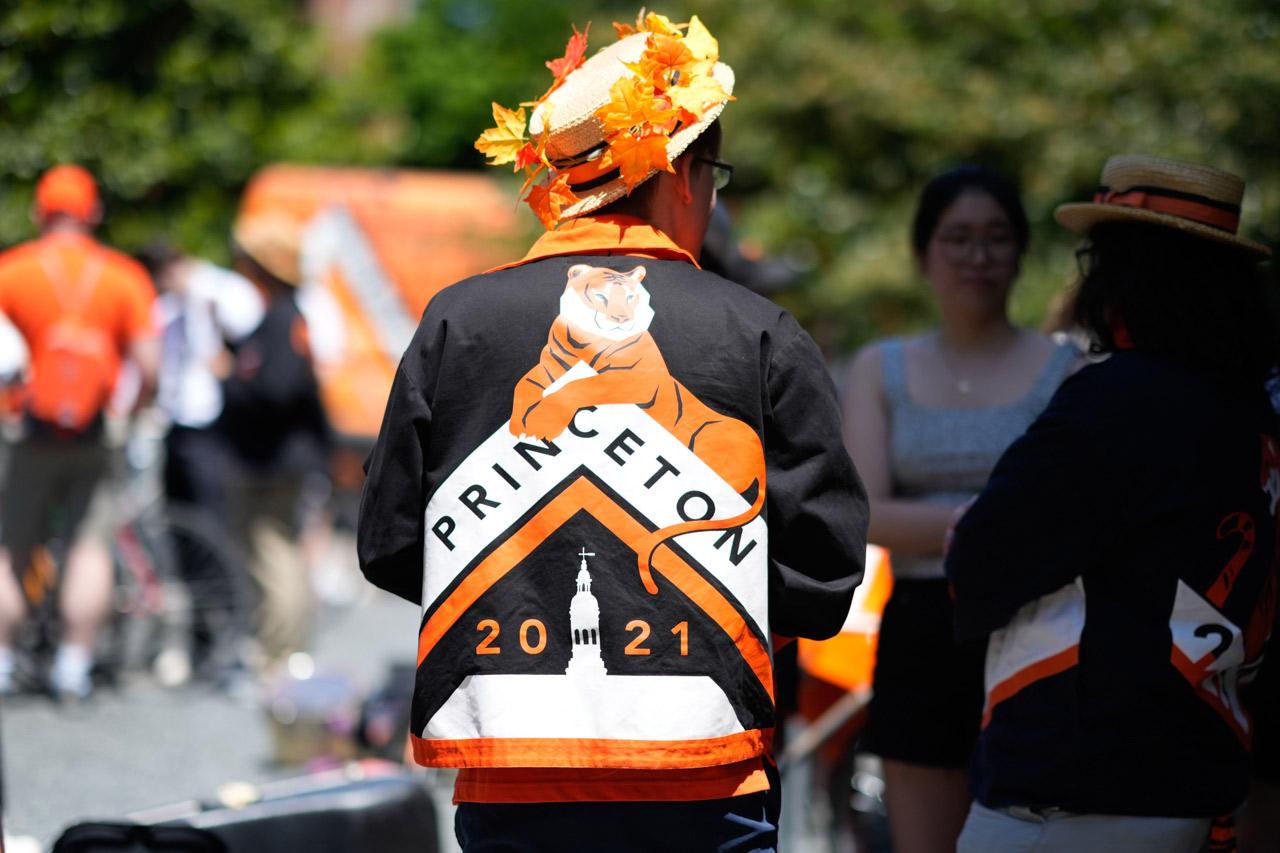 A member of the Class of 2021, wearing his Reunions jacket and hat