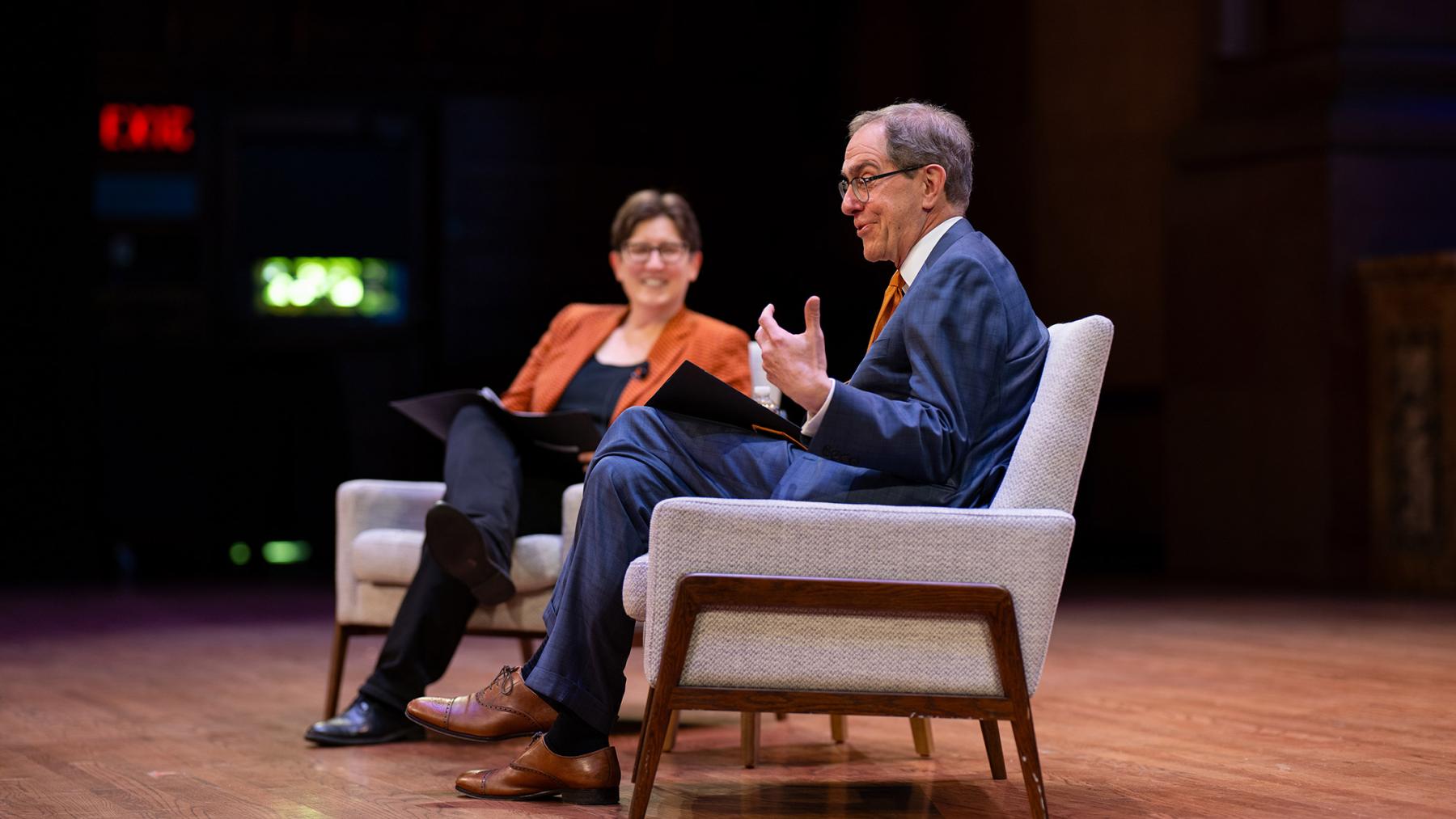 Jen Rexfor and Christopher Eisgruber, seated on the stage of Richardson Auditorium