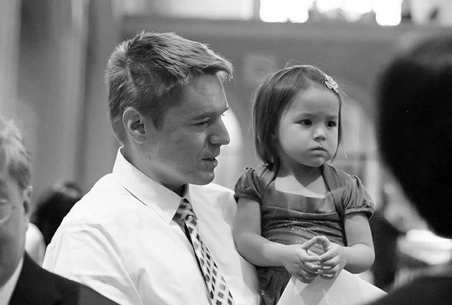 Thor Johnson, holding his infant daughter, Lucy