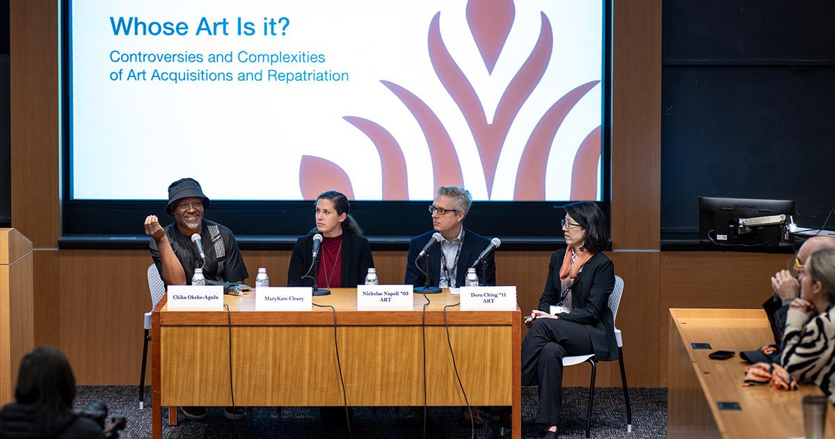 Chika Okeke-Agulu speaks at a Many Minds conference session, seated alongside three other panelists.