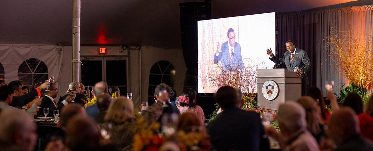 Rodney Priestley makes a toast to the Graduate School from the lecturn in Poe Tent during the Many Minds conference