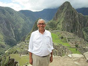Gover standing before mountains and Machu Picchu