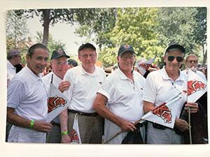Tom Deuel, center, stands with four other men 