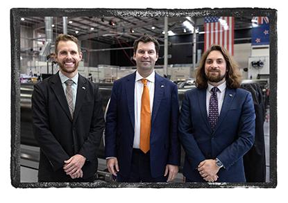 Philosophy major Ethan Magistro (far right) visits the New Zealand manufacturing hub of the U.S. space company Rocket Lab