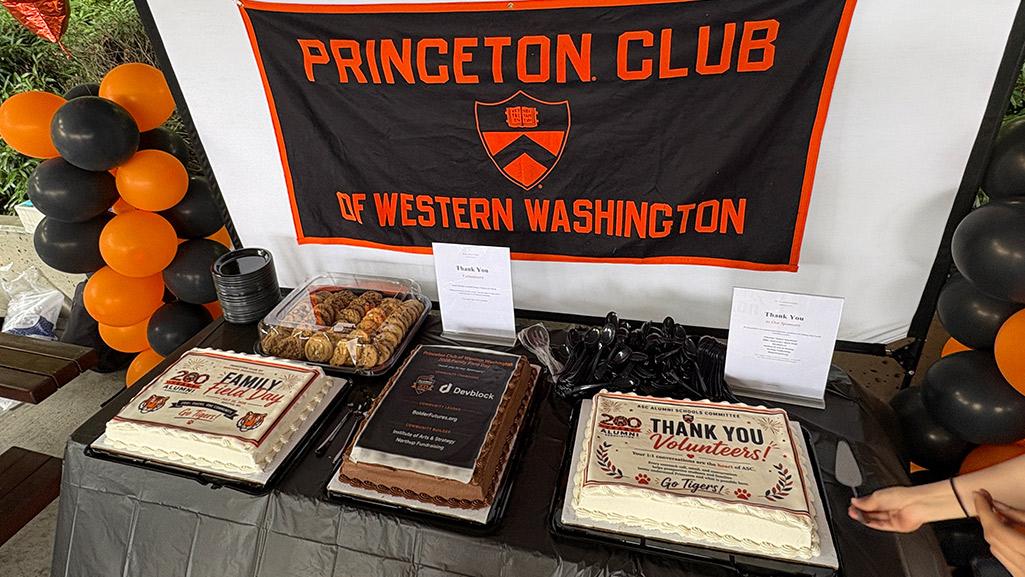 Special cakes celebrating the 200th anniveresary of the Alumni Association and 2026 Field Day, plus the Princeton Club of Western Washington banner.